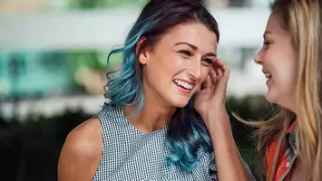 photo of woman with black and turquoise ombre hair