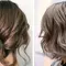 two women with mushroom brown hair from behind