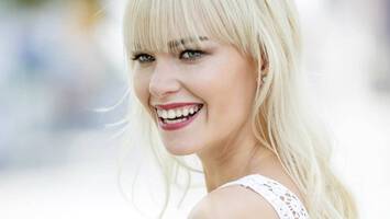 photo of woman with blonde long shag haircut