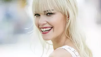 photo of woman with blonde long shag haircut