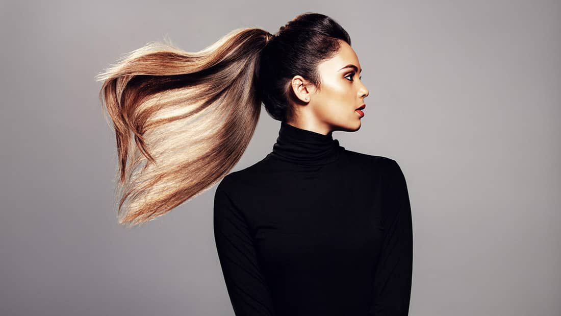 photo of woman with thick ponytail