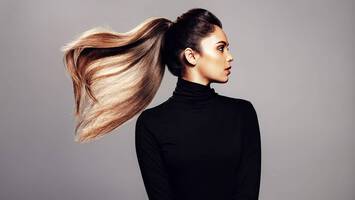 photo of woman with thick ponytail
