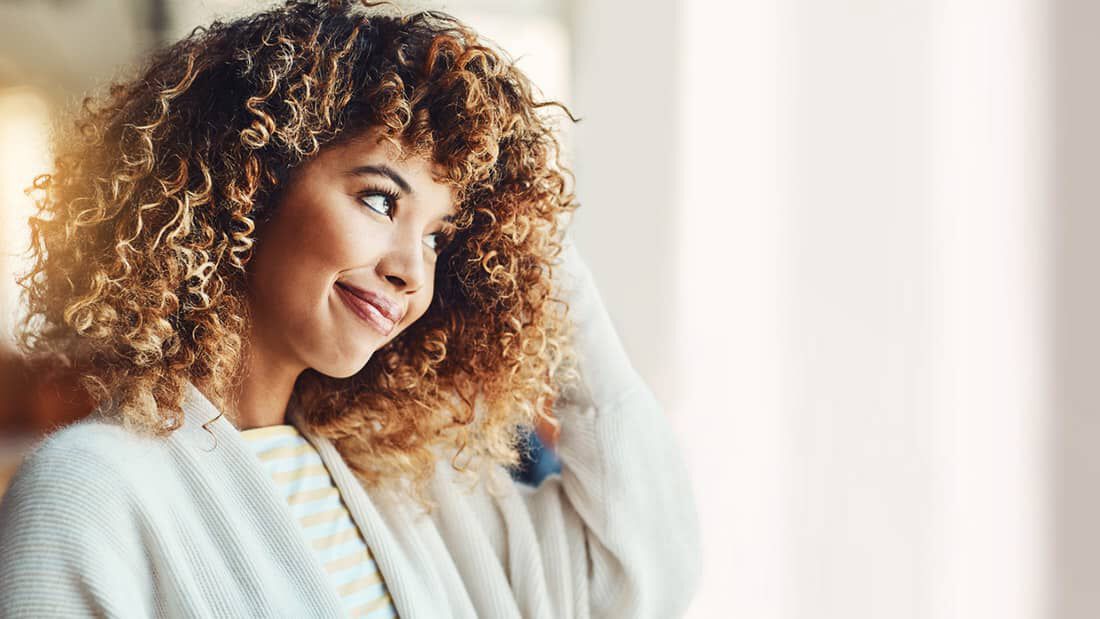 photo of woman with dry curly hair