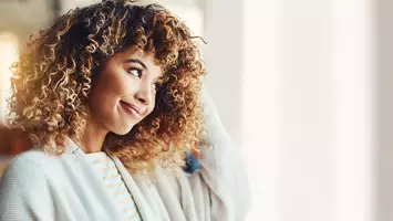 photo of woman with dry curly hair