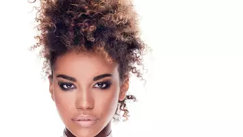 photo of woman with natural updo hairstyle