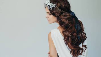 photo of woman with headband and bow hairstyle