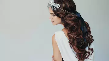 photo of woman with headband and bow hairstyle