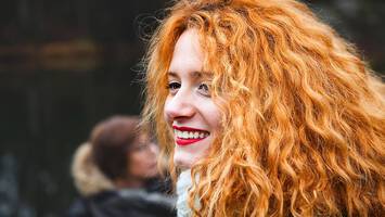 photo of woman with curly orange hair