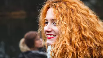 photo of woman with curly orange hair