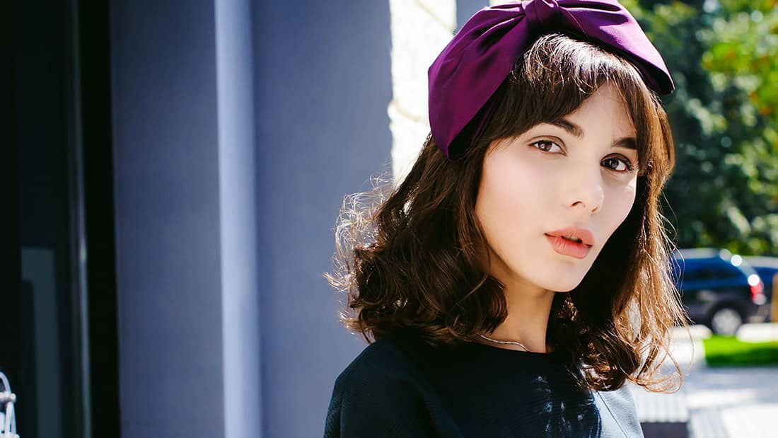 photo of woman with hair bow