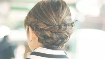 photo of woman with braided updo hairstyle