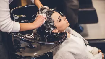 photo of woman receiving salon quality shampoo at salon