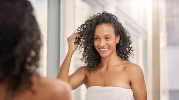 woman air drying her hair