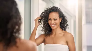 woman air drying her hair
