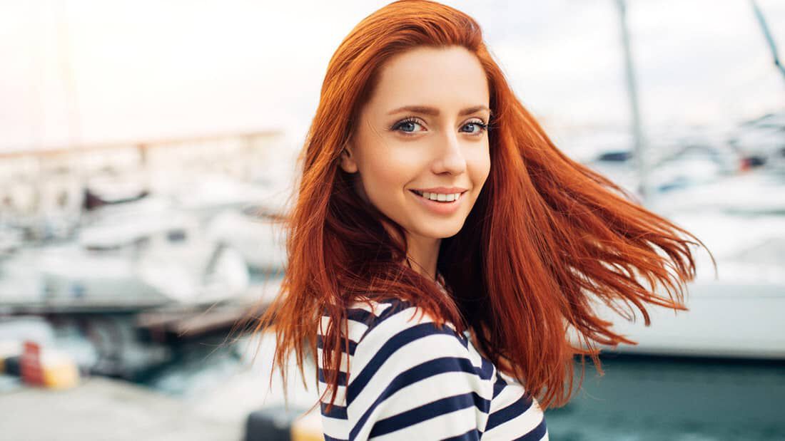 photo of woman with bright red hair color