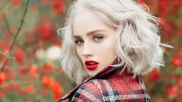 woman with platinum blonde hair and red lips