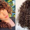 Perm curled brunette hair