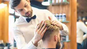photo of man at barber shop with long fade haircut
