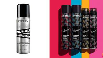 photo of stylist using hairspray on woman's hair