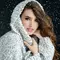 woman with long brown hair in the snow