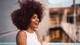 woman with big afro. california bans hair discrimination