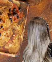 Woman with blonde hair on a background with argan and jojoba oil