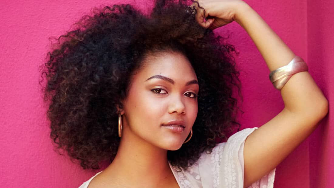 photo of woman with natural dry curly hair