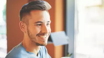 photo of man with pompadour ivy league haircut