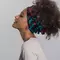 photo of woman with curly hair wearing head wrap accessory