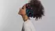 photo of woman with curly hair wearing head wrap accessory