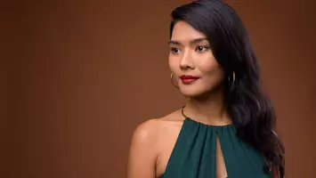 photo of woman with deep side part hairstyle