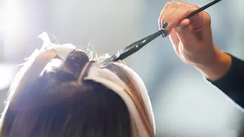 photo of hair coloring in salon how to lighten dyed hair