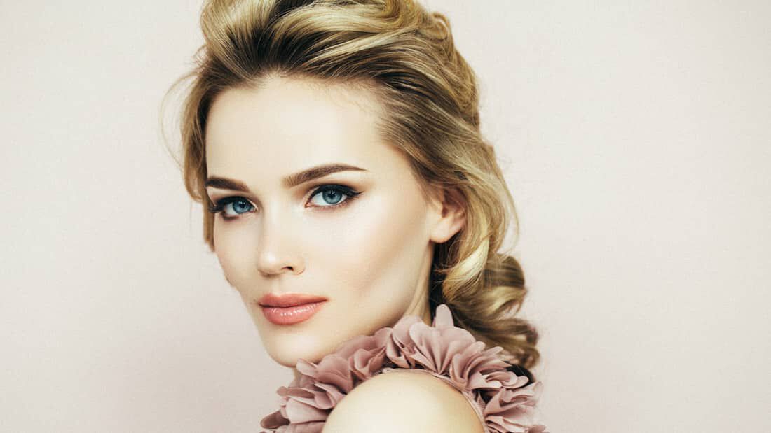 photo of blonde woman with dark roots