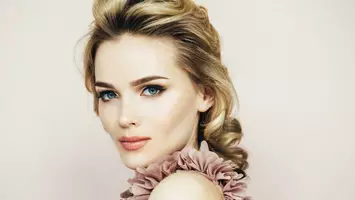 photo of blonde woman with dark roots