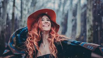 photo of woman with coral hair color pantone color of the year