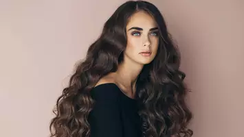 woman with long brown wavy hair