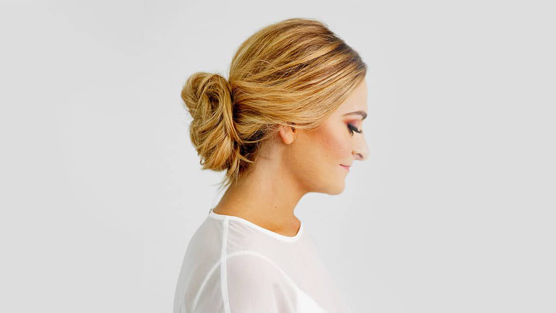 side view of woman with new years eve bun