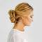 side view of woman with new years eve bun