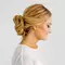 side view of woman with new years eve bun