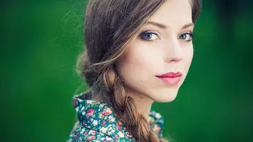photo of woman with long braided hair
