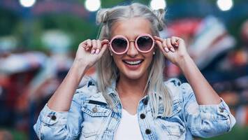 photo of woman with two buns hairstyle