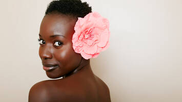 Woman with short hair and flower in her hair