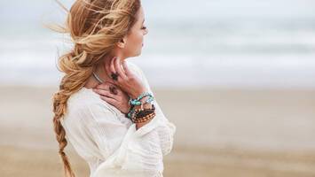 photo of woman on the beach with bohemian style braid
