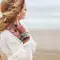 photo of woman on the beach with bohemian style braid