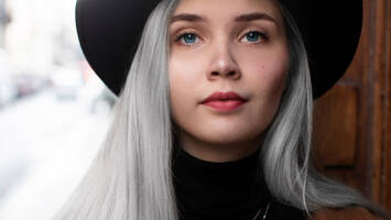 young woman with long grey hair