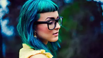 photo of woman with bright blue acid hair color