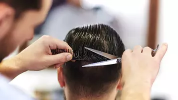 Man gets his hair cut