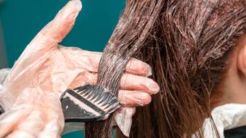 photo of woman getting hair colored