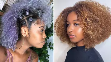 black woman with curly purple hair and a black woman with curly golden caramel hair