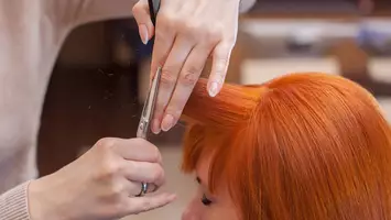 photo of woman getting bangs haircut